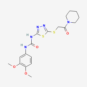 molecular formula C18H23N5O4S2 B2410068 1-(3,4-二甲氧基苯基)-3-(5-((2-氧代-2-(哌啶-1-基)乙基)硫代)-1,3,4-噻二唑-2-基)脲 CAS No. 922815-81-4