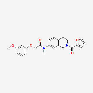 molecular formula C23H22N2O5 B2411193 N-(2-(furan-2-carbonyl)-1,2,3,4-tetrahydroisoquinolin-7-yl)-2-(3-methoxyphenoxy)acetamide CAS No. 955687-84-0