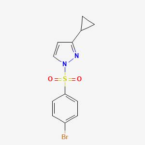 molecular formula C12H11BrN2O2S B2413906 1-[(4-bromophenyl)sulfonyl]-3-cyclopropyl-1H-pyrazole CAS No. 956977-35-8