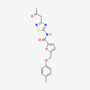 molecular formula C18H17N3O4S B2414441 5-[(4-methylphenoxy)methyl]-N-[3-(2-oxopropyl)-1,2,4-thiadiazol-5-yl]furan-2-carboxamide CAS No. 795294-27-8