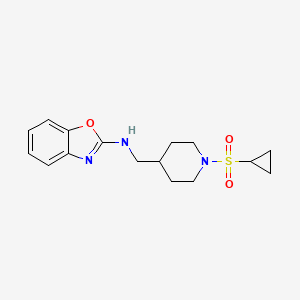 B2415650 N-[(1-Cyclopropylsulfonylpiperidin-4-yl)methyl]-1,3-benzoxazol-2-amine CAS No. 2379988-62-0
