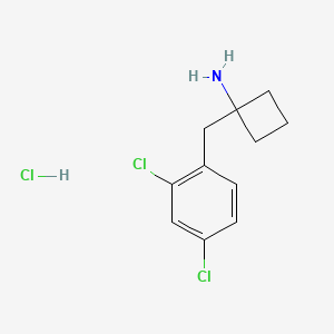 1-[(2,4-Dichlorophenyl)methyl]cyclobutan-1-amine;hydrochloride
