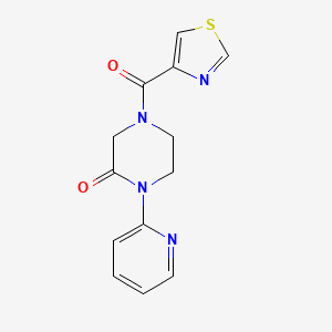 molecular formula C13H12N4O2S B2420900 1-(Pyridin-2-yl)-4-(thiazole-4-carbonyl)piperazin-2-one CAS No. 2320226-58-0