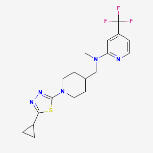 molecular formula C18H22F3N5S B2421450 N-[[1-(5-Cyclopropyl-1,3,4-thiadiazol-2-yl)piperidin-4-yl]methyl]-N-methyl-4-(trifluoromethyl)pyridin-2-amine CAS No. 2415520-28-2