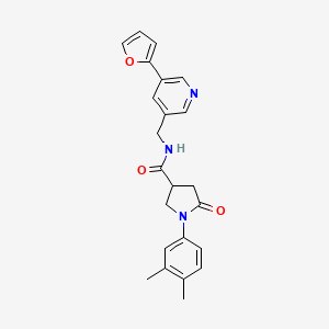 1-(3,4-dimethylphenyl)-N-((5-(furan-2-yl)pyridin-3-yl)methyl)-5-oxopyrrolidine-3-carboxamide