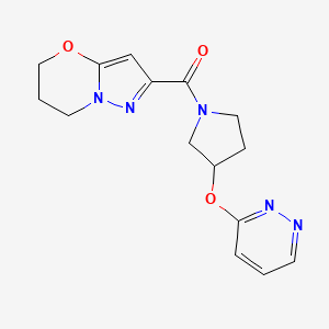 molecular formula C15H17N5O3 B2421726 (6,7-dihydro-5H-pyrazolo[5,1-b][1,3]oxazin-2-yl)(3-(pyridazin-3-yloxy)pyrrolidin-1-yl)methanone CAS No. 2034476-35-0