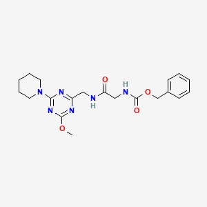 molecular formula C20H26N6O4 B2428281 Benzyl (2-(((4-methoxy-6-(piperidin-1-yl)-1,3,5-triazin-2-yl)methyl)amino)-2-oxoethyl)carbamate CAS No. 2034270-03-4