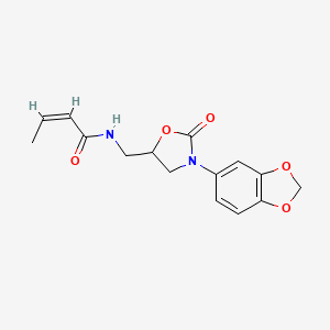 molecular formula C15H16N2O5 B2434165 (Z)-N-((3-(benzo[d][1,3]dioxol-5-yl)-2-oxooxazolidin-5-yl)methyl)but-2-enamide CAS No. 955240-59-2