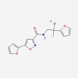 molecular formula C15H14N2O5 B2437803 5-(furan-2-yl)-N-(2-(furan-2-yl)-2-hydroxypropyl)isoxazole-3-carboxamide CAS No. 1396791-11-9