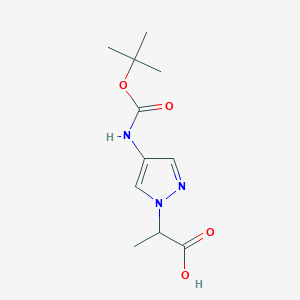 molecular formula C11H17N3O4 B2439388 2-[4-[(2-Methylpropan-2-yl)oxycarbonylamino]pyrazol-1-yl]propanoic acid CAS No. 2248311-52-4