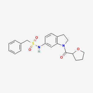 molecular formula C20H22N2O4S B2440853 1-苯基-N-(1-(四氢呋喃-2-羰基)吲哚啉-6-基)甲磺酰胺 CAS No. 1058212-89-7