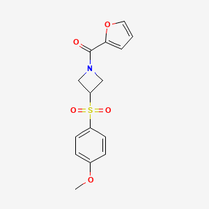 molecular formula C15H15NO5S B2441959 Furan-2-yl(3-((4-methoxyphenyl)sulfonyl)azetidin-1-yl)methanone CAS No. 1797264-00-6