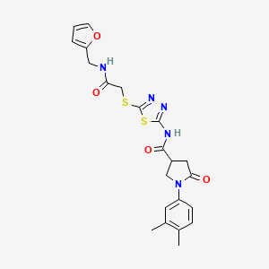 B2443713 1-(3,4-dimethylphenyl)-N-(5-((2-((furan-2-ylmethyl)amino)-2-oxoethyl)thio)-1,3,4-thiadiazol-2-yl)-5-oxopyrrolidine-3-carboxamide CAS No. 872595-49-8