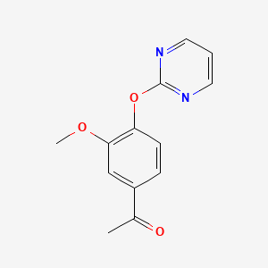 1-[3-Methoxy-4-(pyrimidin-2-yloxy)phenyl]ethan-1-one