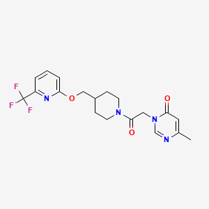 molecular formula C19H21F3N4O3 B2446194 6-Methyl-3-[2-oxo-2-[4-[[6-(trifluoromethyl)pyridin-2-yl]oxymethyl]piperidin-1-yl]ethyl]pyrimidin-4-one CAS No. 2380033-21-4
