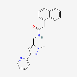 molecular formula C22H20N4O B2446720 N-[(2-Methyl-5-pyridin-2-ylpyrazol-3-yl)methyl]-2-naphthalen-1-ylacetamide CAS No. 2309749-19-5