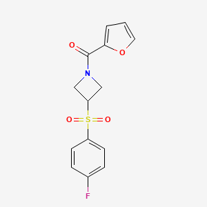 molecular formula C14H12FNO4S B2448160 (3-((4-氟苯基)磺酰基)氮杂环丁-1-基)(呋喃-2-基)甲酮 CAS No. 1448132-94-2
