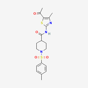 molecular formula C19H23N3O4S2 B2448238 N-(5-乙酰基-4-甲基噻唑-2-基)-1-甲苯磺酰基哌啶-4-甲酰胺 CAS No. 922461-35-6