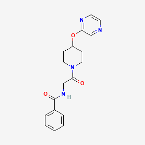 molecular formula C18H20N4O3 B2449687 N-(2-氧代-2-(4-(吡嗪-2-基氧基)哌啶-1-基)乙基)苯甲酰胺 CAS No. 1448078-84-9