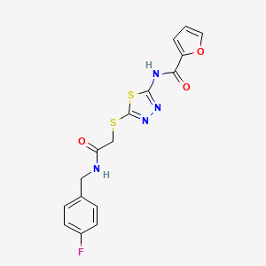 B2450043 N-[5-[2-[(4-fluorophenyl)methylamino]-2-oxoethyl]sulfanyl-1,3,4-thiadiazol-2-yl]furan-2-carboxamide CAS No. 868976-76-5