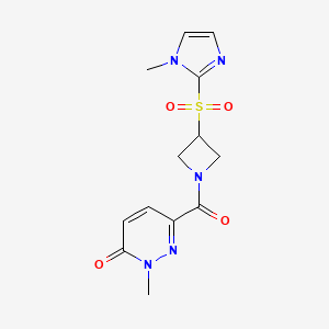 molecular formula C13H15N5O4S B2454052 2-methyl-6-(3-((1-methyl-1H-imidazol-2-yl)sulfonyl)azetidine-1-carbonyl)pyridazin-3(2H)-one CAS No. 2309552-97-2