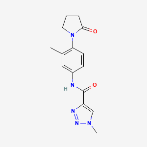 molecular formula C15H17N5O2 B2458803 1-methyl-N-(3-methyl-4-(2-oxopyrrolidin-1-yl)phenyl)-1H-1,2,3-triazole-4-carboxamide CAS No. 1448134-00-6
