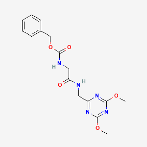 molecular formula C16H19N5O5 B2466657 苯甲酸（2-(((4,6-二甲氧基-1,3,5-三嗪-2-基)甲基)氨基)-2-氧代乙基）氨基甲酸酯 CAS No. 2034539-54-1