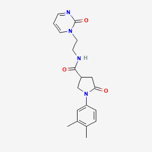 molecular formula C19H22N4O3 B2467212 1-(3,4-dimethylphenyl)-5-oxo-N-(2-(2-oxopyrimidin-1(2H)-yl)ethyl)pyrrolidine-3-carboxamide CAS No. 2195942-45-9
