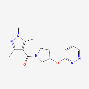 molecular formula C15H19N5O2 B2467965 (3-(pyridazin-3-yloxy)pyrrolidin-1-yl)(1,3,5-trimethyl-1H-pyrazol-4-yl)methanone CAS No. 2034434-57-4
