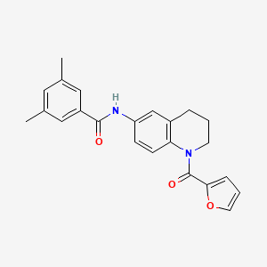molecular formula C23H22N2O3 B2469412 N-[1-(2-furoyl)-1,2,3,4-tetrahydroquinolin-6-yl]-3,5-dimethylbenzamide CAS No. 946367-43-7