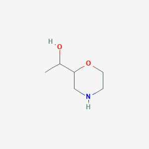 molecular formula C6H13NO2 B2470689 1-(Morpholin-2-yl)ethan-1-ol CAS No. 1314908-48-9
