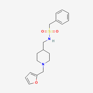 molecular formula C18H24N2O3S B2474758 N-((1-(呋喃-2-基甲基)哌啶-4-基)甲基)-1-苯甲磺酰胺 CAS No. 953140-53-9
