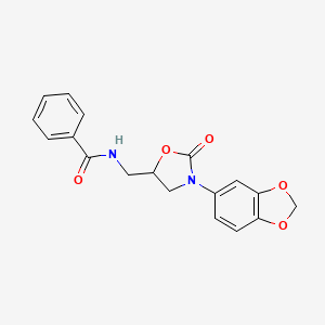 molecular formula C18H16N2O5 B2475349 N-((3-(苯并[d][1,3]二氧杂环戊烯-5-基)-2-氧代恶唑烷-5-基)甲基)苯甲酰胺 CAS No. 954675-79-7