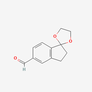 molecular formula C12H12O3 B2476028 5-Formyl-indan-1-one 1,2-ethanediol ketal CAS No. 908860-66-2