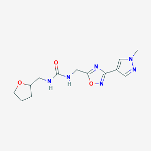 molecular formula C13H18N6O3 B2476360 1-((3-(1-methyl-1H-pyrazol-4-yl)-1,2,4-oxadiazol-5-yl)methyl)-3-((tetrahydrofuran-2-yl)methyl)urea CAS No. 2034534-39-7