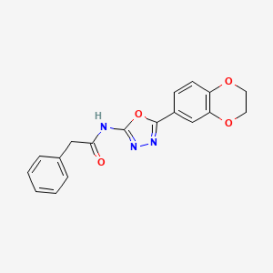 molecular formula C18H15N3O4 B2477848 N-(5-(2,3-dihydrobenzo[b][1,4]dioxin-6-yl)-1,3,4-oxadiazol-2-yl)-2-phenylacetamide CAS No. 851094-69-4