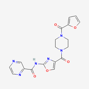 molecular formula C18H16N6O5 B2477926 N-(4-(4-(呋喃-2-甲酰基)哌嗪-1-甲酰基)恶唑-2-基)吡嗪-2-甲酰胺 CAS No. 1396677-72-7