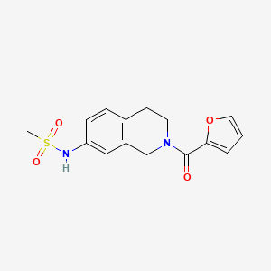molecular formula C15H16N2O4S B2479106 N-(2-(furan-2-carbonyl)-1,2,3,4-tetrahydroisoquinolin-7-yl)methanesulfonamide CAS No. 955649-44-2