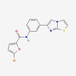 molecular formula C16H10BrN3O2S B2482640 5-bromo-N-(3-{imidazo[2,1-b][1,3]thiazol-6-il}fenil)furan-2-carboxamida CAS No. 872630-08-5