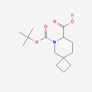 molecular formula C14H23NO4 B2484147 6-(tert-Butoxycarbonyl)-6-azaspiro[3.5]nonane-7-carboxylic acid CAS No. 2228127-33-9