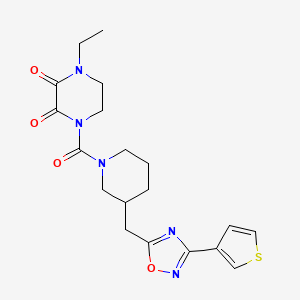 molecular formula C19H23N5O4S B2485261 1-Ethyl-4-(3-((3-(thiophen-3-yl)-1,2,4-oxadiazol-5-yl)methyl)piperidine-1-carbonyl)piperazine-2,3-dione CAS No. 1795484-27-3