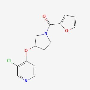 molecular formula C14H13ClN2O3 B2488540 (3-((3-Chloropyridin-4-yl)oxy)pyrrolidin-1-yl)(furan-2-yl)methanone CAS No. 2034432-44-3