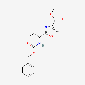 molecular formula C18H22N2O5 B2489643 methyl 2-[(1R)-1-{[(benzyloxy)carbonyl]amino}-2-methylpropyl]-5-methyl-1,3-oxazole-4-carboxylate CAS No. 1418113-47-9