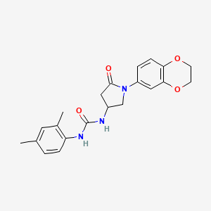molecular formula C21H23N3O4 B2490678 1-(1-(2,3-Dihydrobenzo[b][1,4]dioxin-6-yl)-5-oxopyrrolidin-3-yl)-3-(2,4-dimethylphenyl)urea CAS No. 877641-04-8