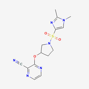 molecular formula C14H16N6O3S B2497011 3-((1-((1,2-dimethyl-1H-imidazol-4-yl)sulfonyl)pyrrolidin-3-yl)oxy)pyrazine-2-carbonitrile CAS No. 2034577-20-1