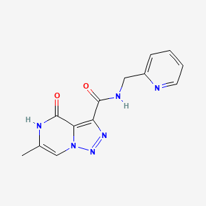 molecular formula C13H12N6O2 B2500178 6-methyl-4-oxo-N-(pyridin-2-ylmethyl)-4,5-dihydro-[1,2,3]triazolo[1,5-a]pyrazine-3-carboxamide CAS No. 1795485-59-4