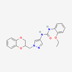 molecular formula C21H22N4O4 B2503552 3-{1-[(2,3-ジヒドロ-1,4-ベンゾジオキシン-2-イル)メチル]-1H-ピラゾール-4-イル}-1-(2-エトキシフェニル)尿素 CAS No. 1797639-52-1