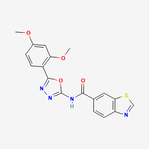 molecular formula C18H14N4O4S B2503848 N-[5-(2,4-ジメトキシフェニル)-1,3,4-オキサジアゾール-2-イル]-1,3-ベンゾチアゾール-6-カルボキサミド CAS No. 865286-87-9