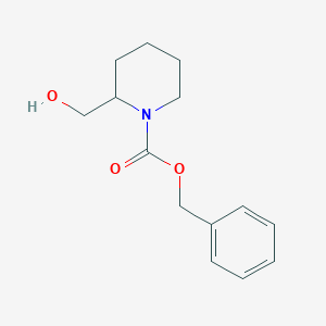 molecular formula C14H19NO3 B025055 苯甲酸苄酯 2-(羟甲基)哌啶-1-甲酯 CAS No. 105706-75-0