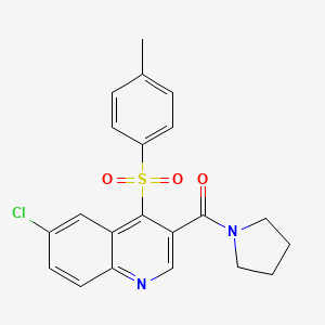 molecular formula C21H19ClN2O3S B2509701 (6-Chloro-4-tosylquinolin-3-yl)(pyrrolidin-1-yl)methanone CAS No. 1111015-65-6